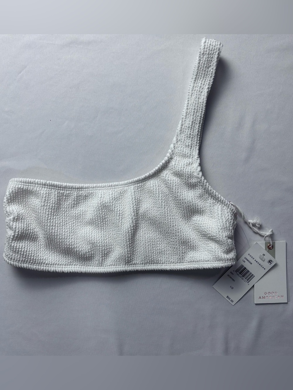Good American Always Fits one-shoulder bikini top features a textured, crinkle